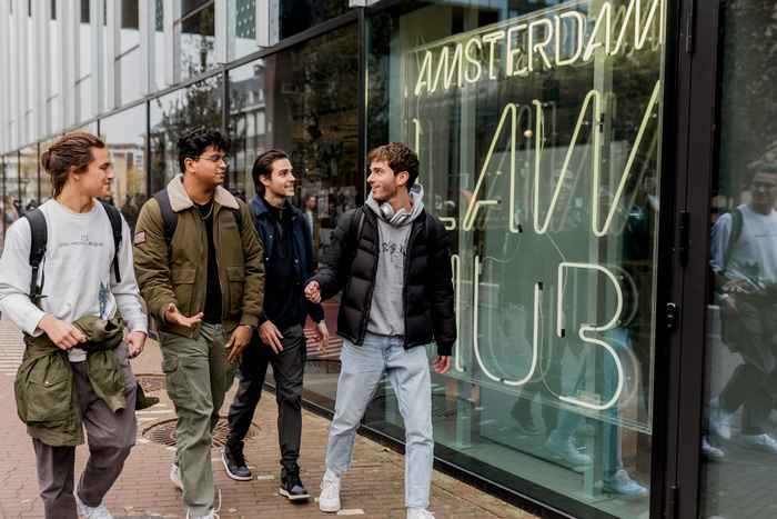 Group of students in front of the Amsterdam Law Hub building